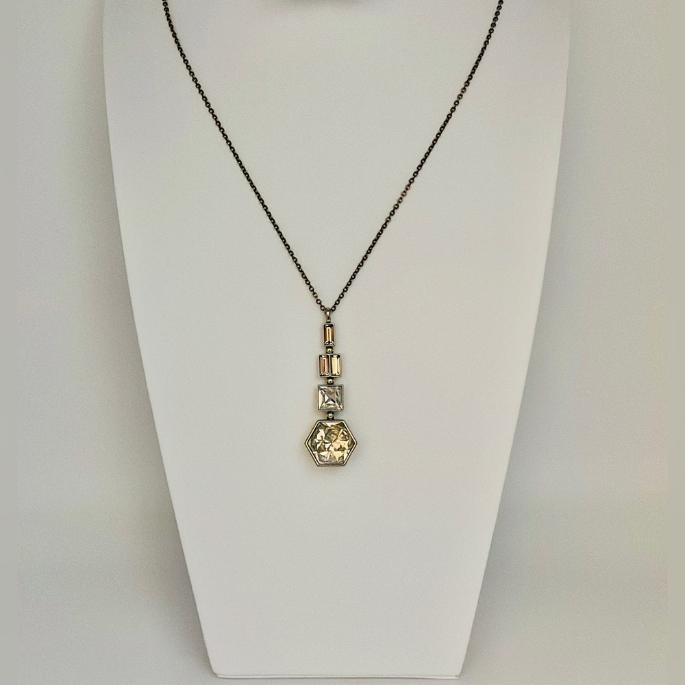 IN SHAPE PENDANT, ANTIQUE 
Touchstone Crystal by Swarovski